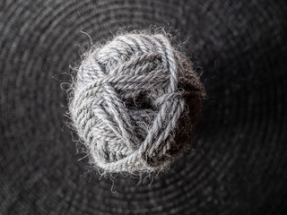 Ball of grey wool yarn from above