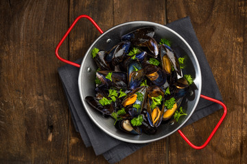 Seafood Mussels in Pan, Top View on Wooden Background, Copy Space