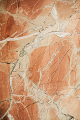 Marble surface as texture and background for design. Orange marble texture.   