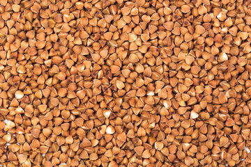Macro Photo food buckwheat groats. Texture background grain buckwheat groats. Image food product porridge buckwheat grains