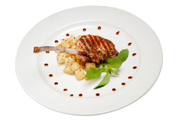 Fried rib of a young lamb with potato on white isolated background