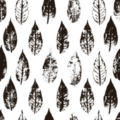 Vector seamless pattern with dark brown , sepia silhouettes of leaves. Monochrom autumn design.