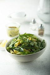 Pasta salad with pesto and arugula
