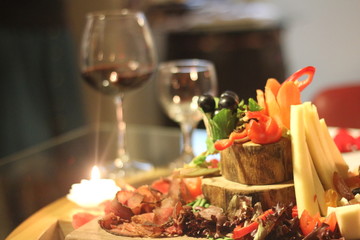 wine glass and cheese plate