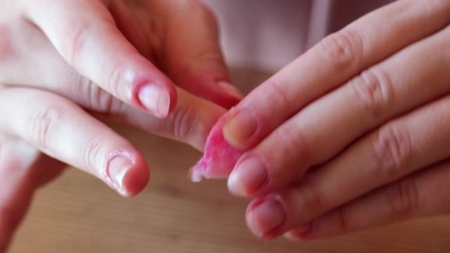 Close Up Female Hands Removing Nail Polish With Cotton Pad, Tilt Up.