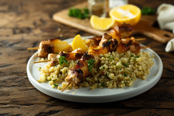 Homemade chicken skewers with bulgur and herbs