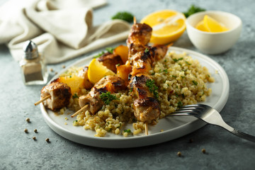 Homemade chicken skewers with bulgur and herbs