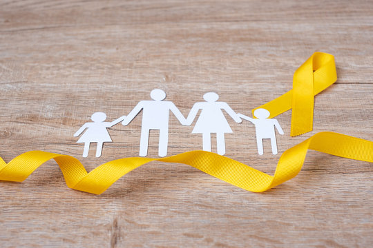 Suicide prevention and Childhood Cancer Awareness, Yellow Ribbon and family paper shape for supporting people living and illness. children Healthcare and World cancer day concept