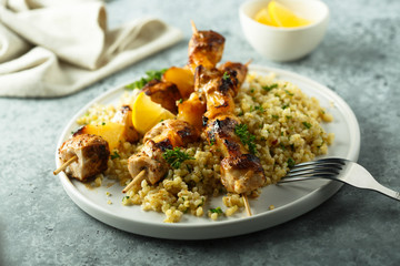 Homemade chicken skewers with bulgur and herbs