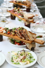 cutting on a wooden stand on the festive table