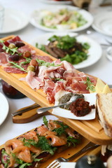 cutting on a wooden stand on the festive table