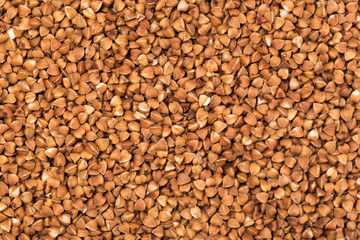 Macro Photo food buckwheat groats. Texture background grain buckwheat groats. Image food product porridge buckwheat grains