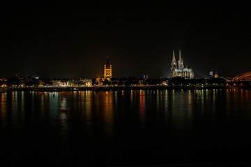 Obraz na płótnie Canvas Cologne a city on the Rhine at night as a skyline