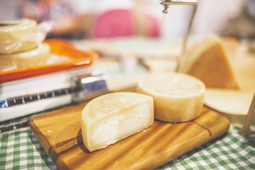 Close up of cheese pieces on table.