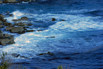 wavy sea and rocks pier