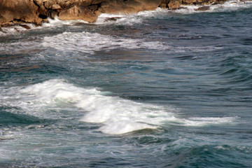 wavy sea and rocks pier