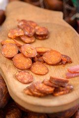 Sausage Festival (Csabai Kolbaszfesztival) Sausage exhibition and fair. Sliced sausage on a wooden board for tasting