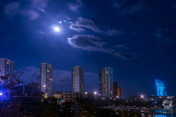 Fototapeta premium Night city view. Full moon. Sanya China