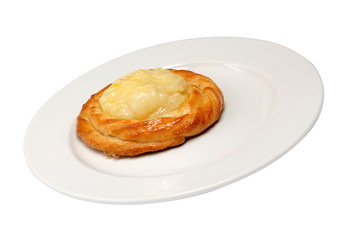 Buns with cottage cheese on plate on a white isolated background