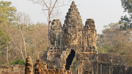 Sculpture of the smiling stone faces on upper terrace of "faces tower", the iconic smiling faces of the Bayon temple in Angkor Thom, Khmer architecture style, Siem Reap, Cambodia.