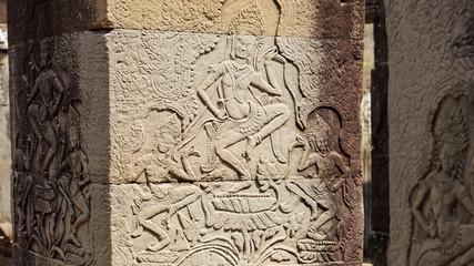 Bas reliefs depicting the beautiful Apsara deva on the wall at Angkor Wat Temple built in the 12th...