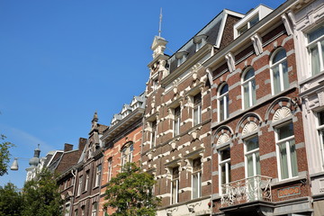 Fototapeta na wymiar Historic buildings with carvings located in Wyck neighborhood (on Wycker Brugstraat street), Limbourg, Maastricht, Netherlands