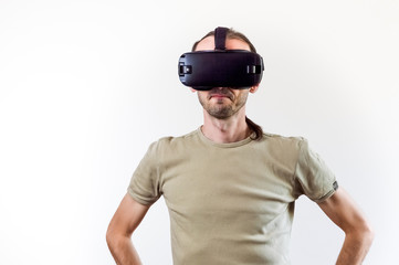 Man exploring modern technology virtual reality with head mounted display on white background