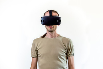 Man exploring modern technology virtual reality with head mounted display on white background