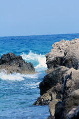 wavy sea and rocks and beach