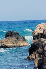 wavy sea and rocks and beach