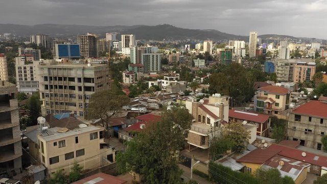 Drone flight over residential neighborhood in central district Addis Ababa, homes and apartment buildings in Ethiopia's capital city