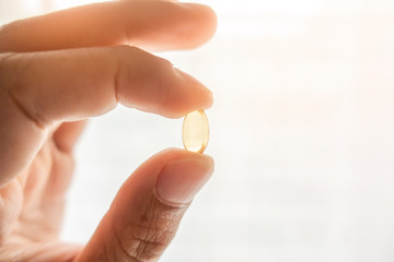 Close up hand is holding vitamins pills