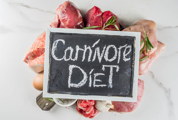 Carnivore diet background. Non vegan protein sources, Different meat food - chicken breast, pork steak, beef tenderloin, eggs, spices for cooking. White marble background copy space - obrazy, fototapety, plakaty