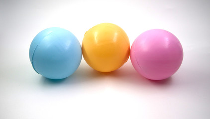three plastic colorful balls isolated on white background