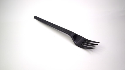 black plastic fork isolated on white background