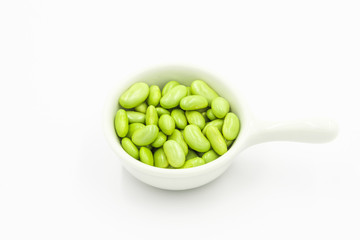 green peas in a bowl isolated on white background