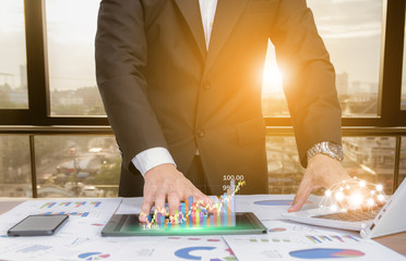 businessman analyze graphs with computers, smartphones and tablet technology social networks..