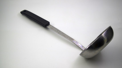 Metal kitchen soup ladle isolated on white background