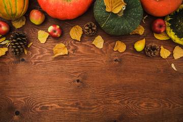 Thanksgiving autumn background with pumpkins and apple. Flat lay, top view