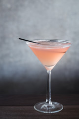 Office.Ladies Green Tea cocktail with Triple sec, vodka, green tea, cranberry juice, lime juice served in a martini glass