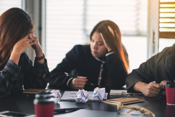 Businesspeople get stressed while having a problem in business meeting