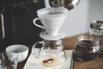 Drip coffee on a wooden bar White background