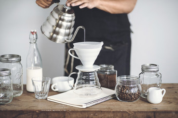 Drip coffee on a wooden bar White background