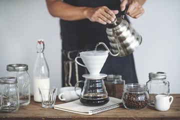 Drip coffee on a wooden bar White background