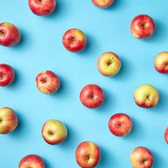 Fruit apples pattern on blue.