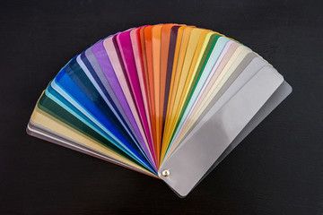 Colorful swatch in stripes close up on dark