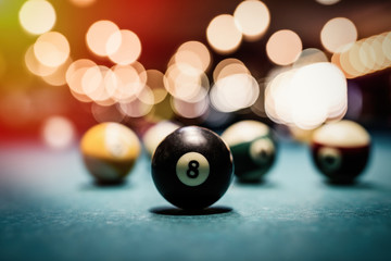 Colorful billiard balls on table close up