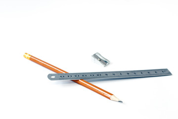 Pencil and ruler with a pen on a white background. Draw. Paint. Close-up. Copy space