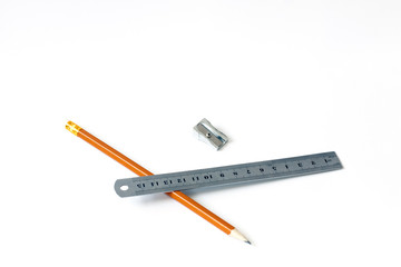 Pencil and ruler with a pen on a white background. Draw. Paint. Close-up. Copy space