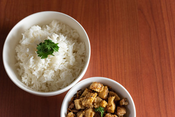 Thai cuisine, Northern of Thailand Lanna style, Hot steamed rice with crispy belly pork in chili flavor, Space for text